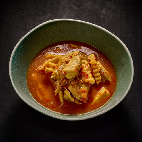 Sour Curry With Fish And Coconut Shoots